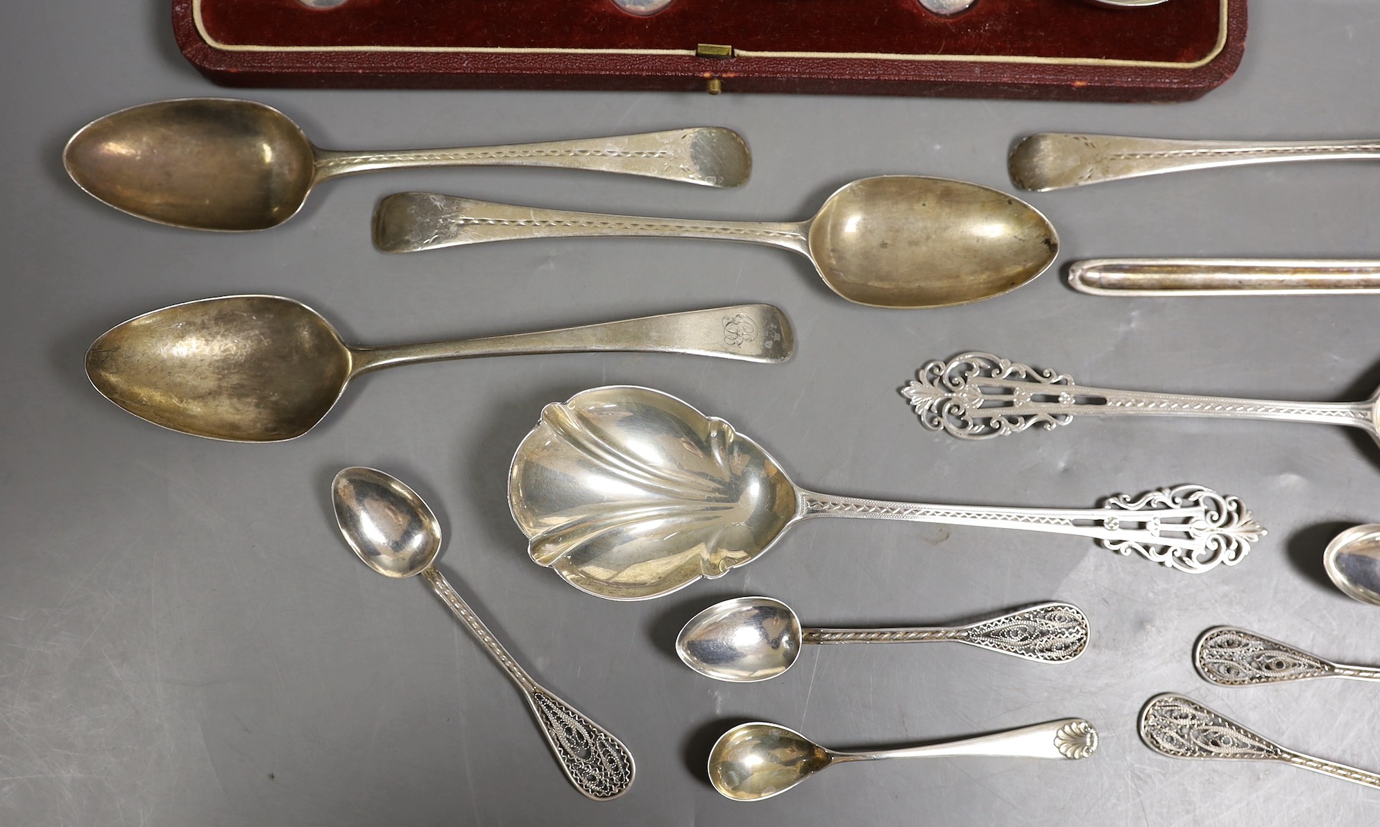 A cased set of George V silver Old English pattern soup spoons, Harrod's Ltd, Sheffield, 1934 and a cased set of six silver handled tea knives and sundry silver and white metal flatware.